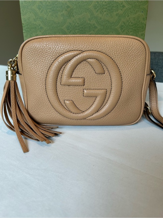 Gucci Handbags - Gucci Beige Pebbled Leather Disco Crossbody with Tassel